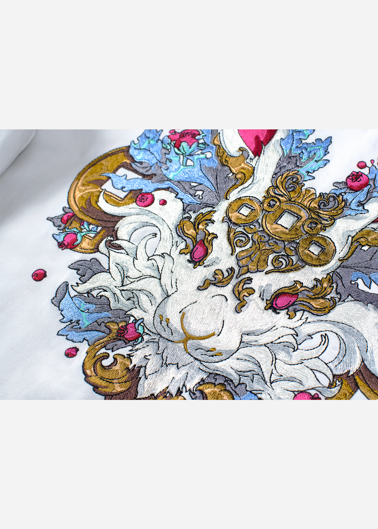 Close up of the intricate embroidery of the Zodiac Rabbit Bomber Jacket design, featuring multiple colors