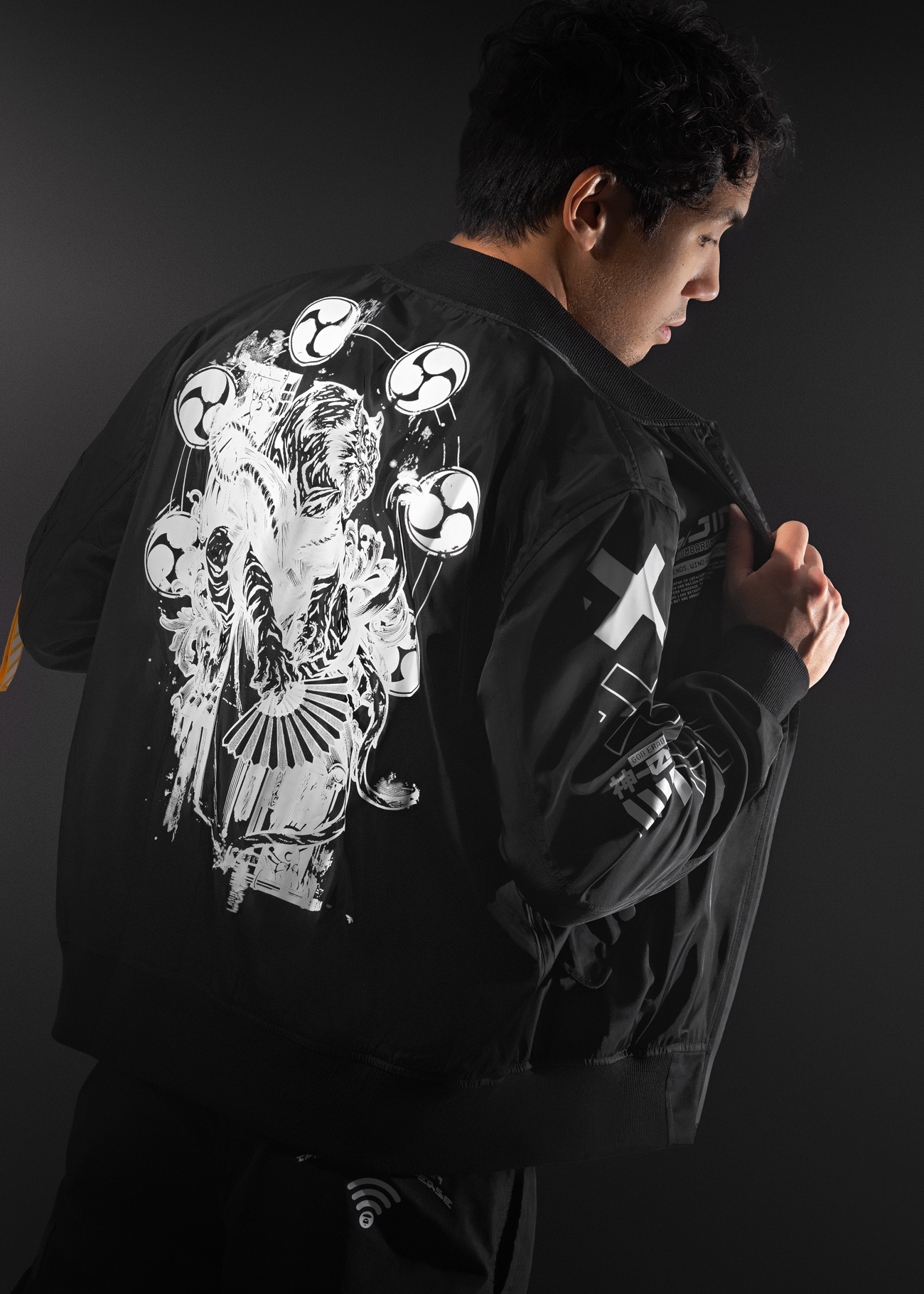 Black Bomber Jacket featuring The Raijin, a figure from japanese mythology converted to a high quality anime inspired bomber jacket